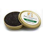 Open tin of Da Vinci Royal caviar displaying glossy dark brown pearls with smooth texture and medium size.