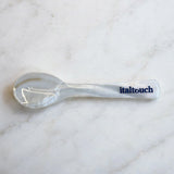 Handcrafted mother of pearl caviar spoon by Italtouch, featuring a natural iridescent finish, designed for elegant caviar serving.