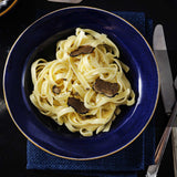 Premium Italian gourmet hamper featuring truffle sauce, truffle carpaccio, egg tagliatelle, aged balsamic vinegar and extra virgin olive oil — perfect for creating authentic truffle pasta, salads and luxury home-cooked meals.